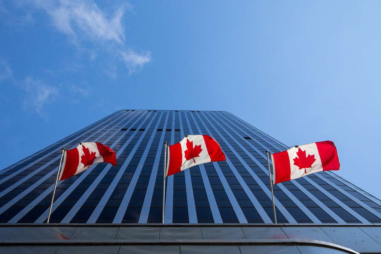 three-canadian-flags-in-front-of-a-business-building-in-ottawa-ontario