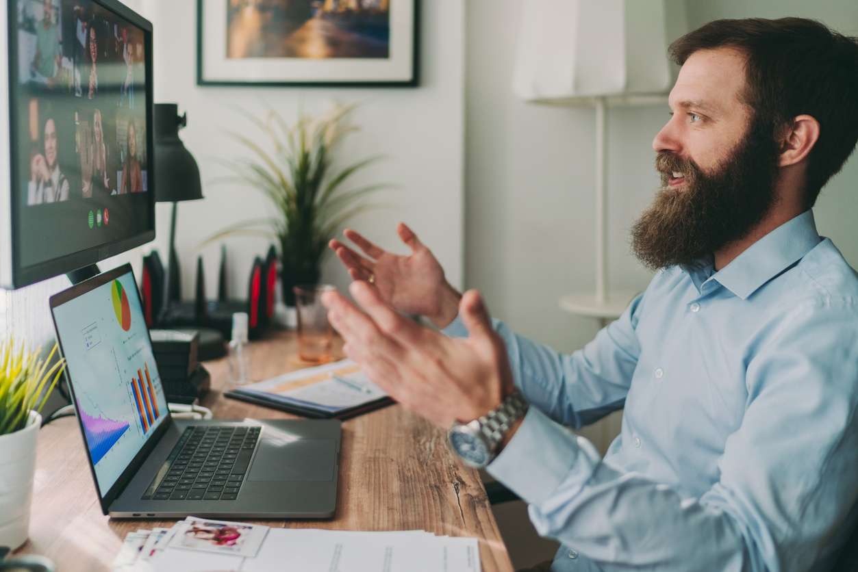 Businessman interviewing applicants online using a computer - understanding annual leave entitlement for Canadian workers.