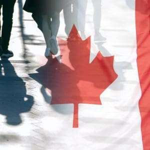 Shadows of Canadian students with the flag of Canada