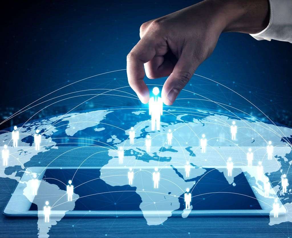 EOR vs PEO: Hiring manager's hand picking floating image of person, digital concept of hiring global talent.