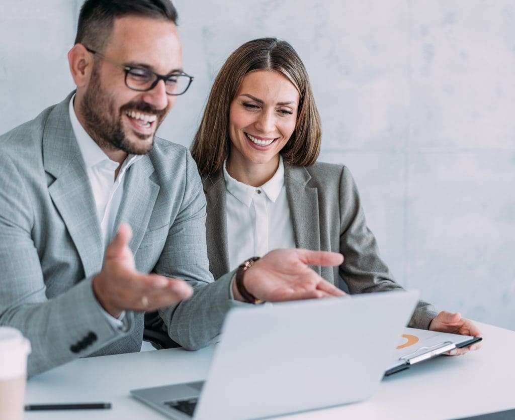 Corporate managers using a laptop for web conference.