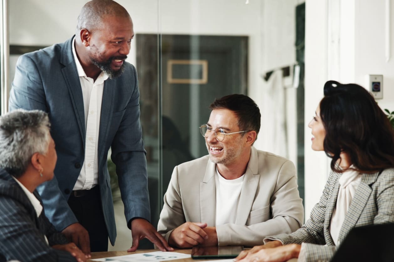 Cost-effectiveness of EOR - A group of business owners having a meeting in an office.
