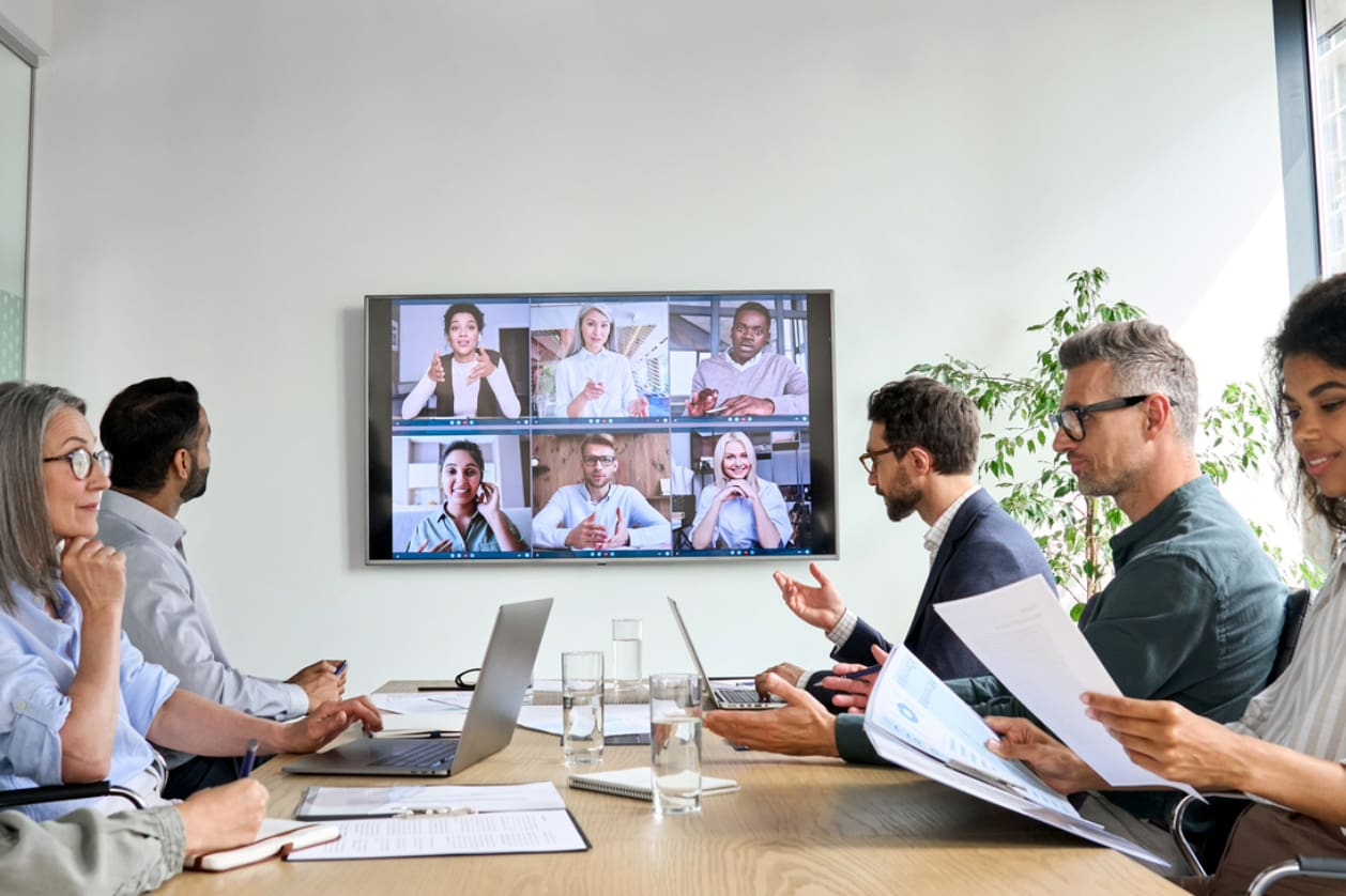 International business expansion compliance - A group of business owners having a virtual meeting with their colleagues.