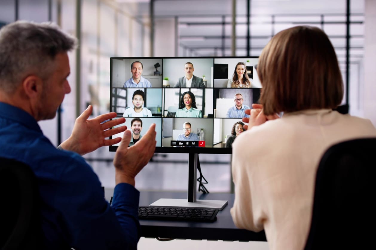 Hiring in Canada - Two business owners having virtual meeting with their international employees.