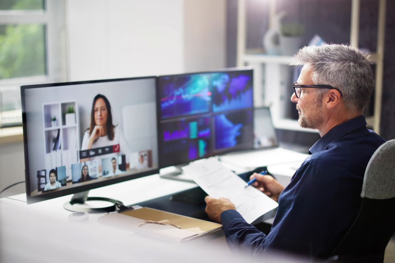 Hiring in Canada - A businessman having a virtual meeting with his Canadian business partner.